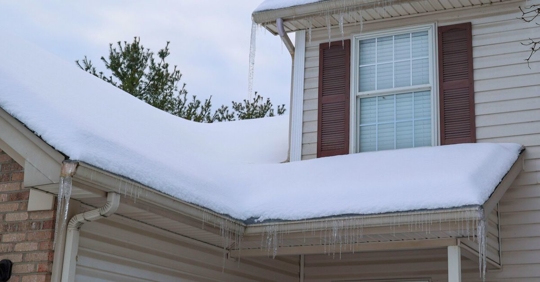 Snow covered rooftop on a home